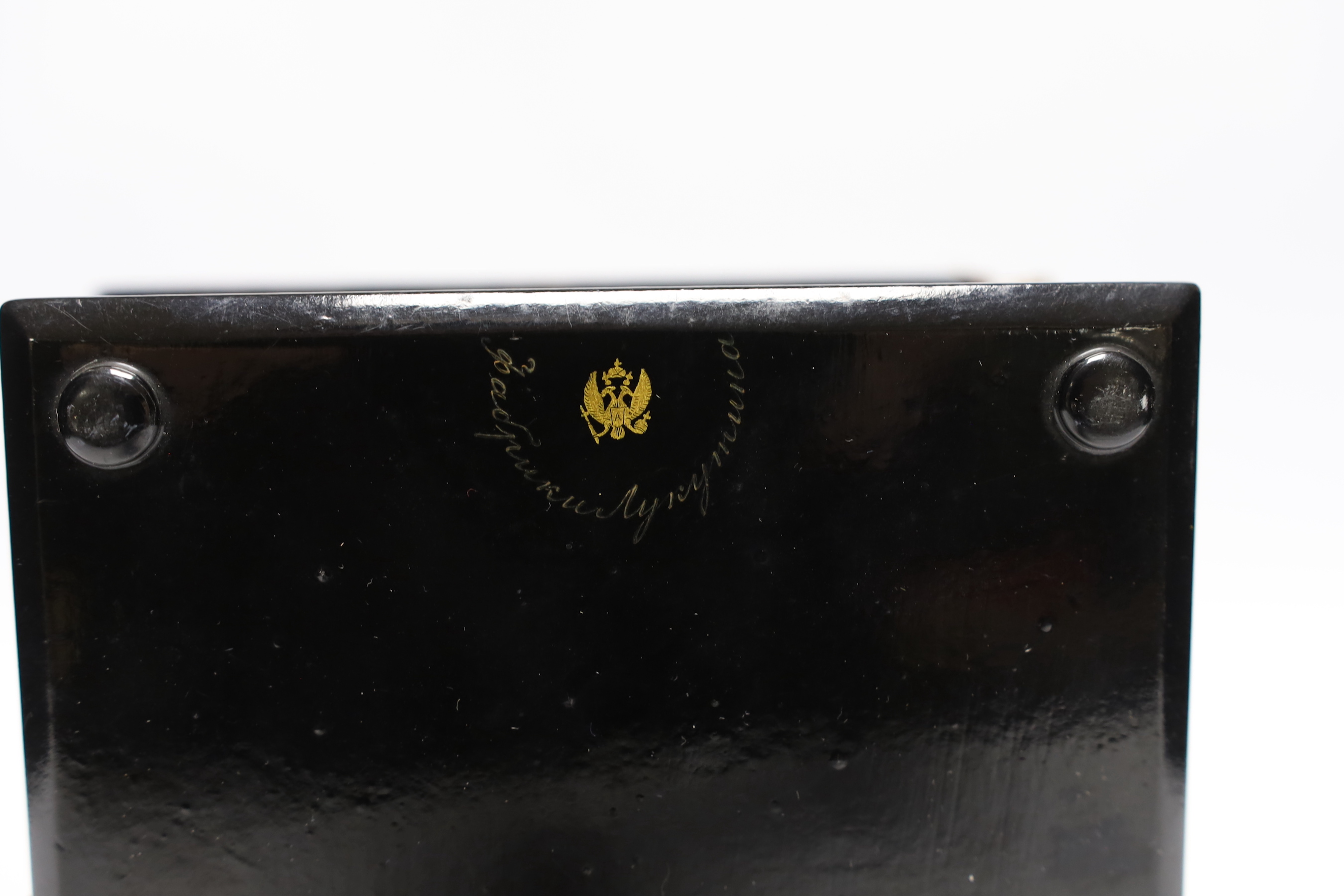 A Russian lacquer boarded photograph album, Lukutin, late 19th century, decorated with a couple and child, containing Victorian photographs, 16 cm x 13.5cm, Please note this lot attracts an additional import tax of 5% on